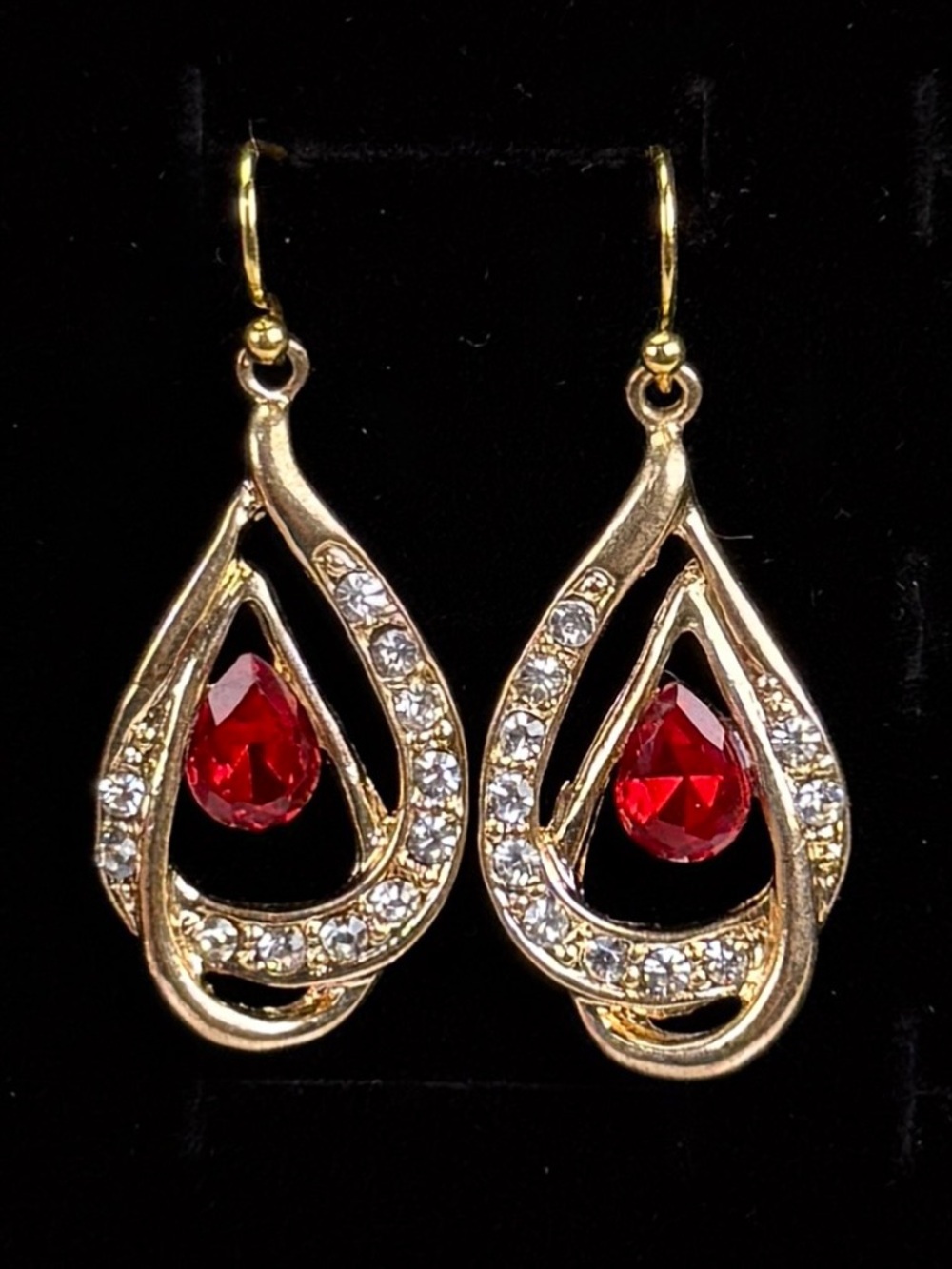 Pretty aged goldtone red and clear bling accent pierced earrings